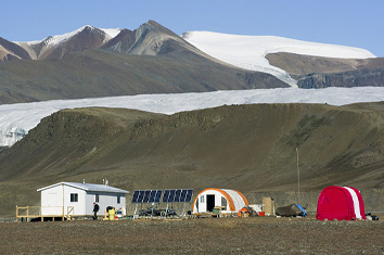 research huts at the foot of a mountain