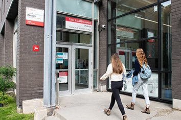 people walking into a building